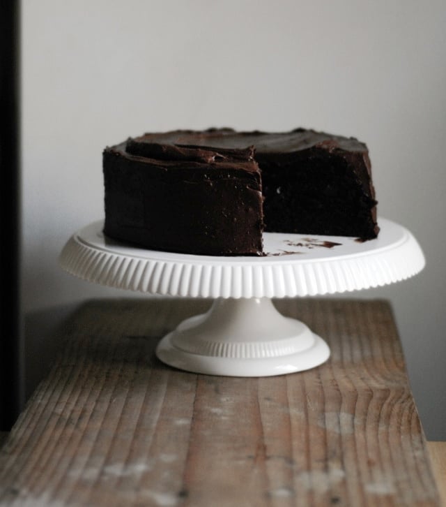 A moist and delicious strawberry and chocolate cake recipe with a decadent chocolate frosting. This chocolate layer cake is perfect for all celebrations! | sophisticatedgourmet.com