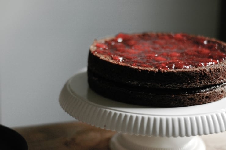 A moist and delicious strawberry and chocolate cake recipe with a decadent chocolate frosting. This chocolate layer cake is perfect for all celebrations! | sophisticatedgourmet.com