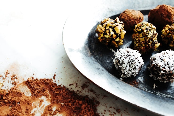 An easy recipe for melt-in-your-mouth, Chocolate Truffles made with luscious dark chocolate and amaretto liqueur. | sophisticatedgourmet.com