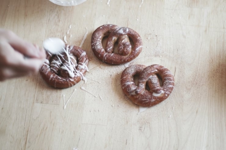 Coffee glaze drizzled on cinnamon sugar pretzels