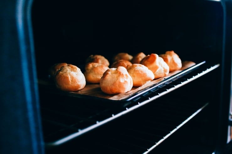 A recipe for perfect, light and airy, fool-proof profiteroles (cream puffs) topped with chocolate sauce. Classy and easy! | sophisticatedgourmet.com