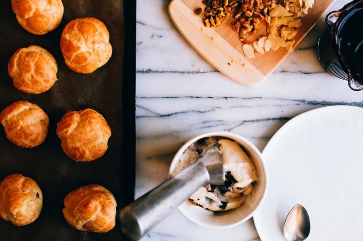 A recipe for perfect, light and airy, fool-proof profiteroles (cream puffs) topped with chocolate sauce. Classy and easy! | sophisticatedgourmet.com