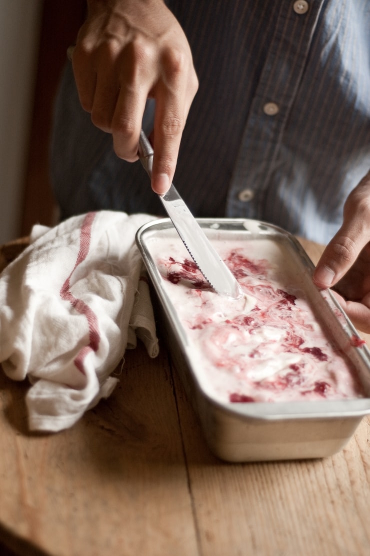 A delightful vanilla ice cream recipe swirled with homemade strawberry sauce. | sophisticatedgourmet.com