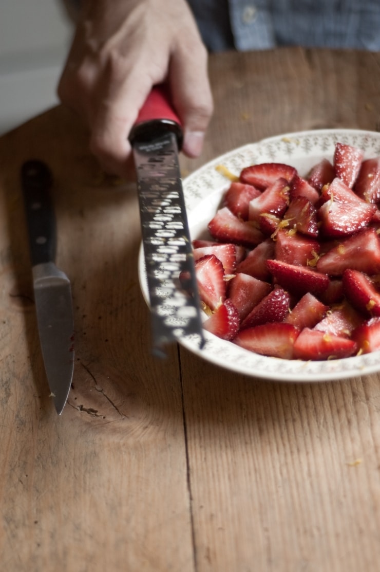 A delightful vanilla ice cream recipe swirled with homemade strawberry sauce. | sophisticatedgourmet.com