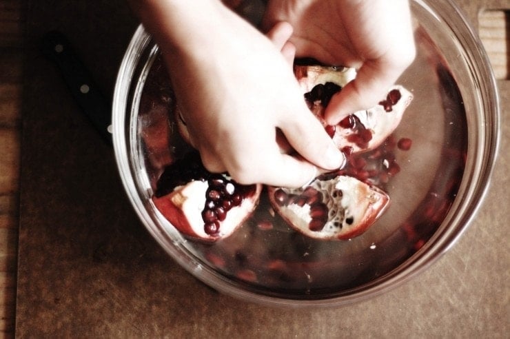 Cutting and de-seeding a pomegranate can be a messy and tedious task. Here's a method that is quick, easy, and will leave your favorite shirt stain-free. | sophisticatedgourmet.com