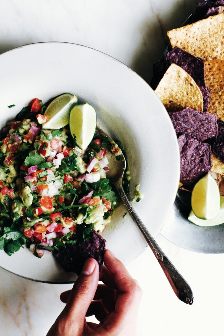 Guacamole is easy and comes together in no time. This guacamole recipe is no exception. It packs a lot of flavor and is perfect with chips and a drink. | sophisticatedgourmet.com