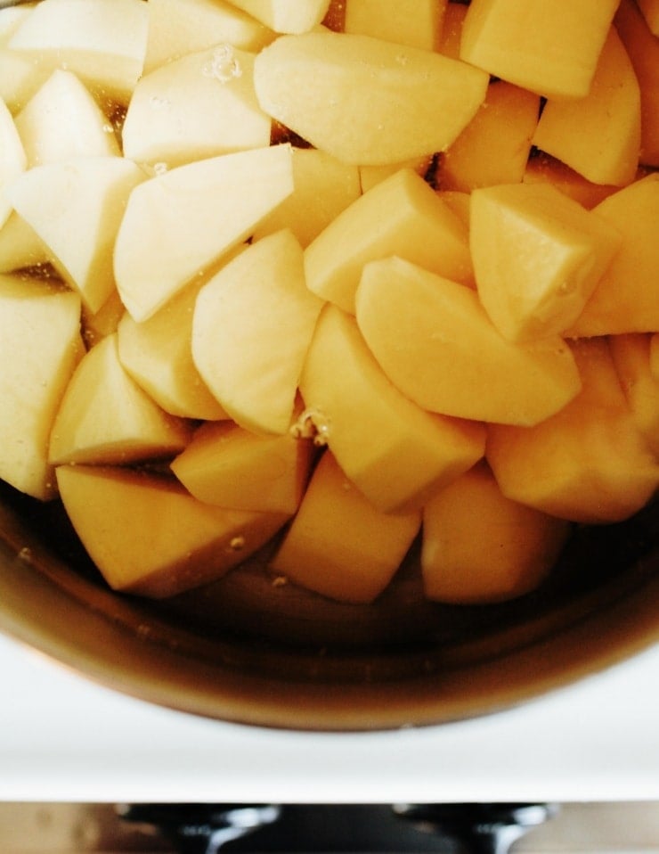 Cut potatoes in water, boiling