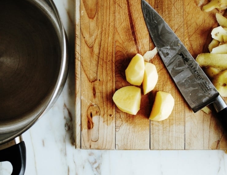 Potatoes on cutting board