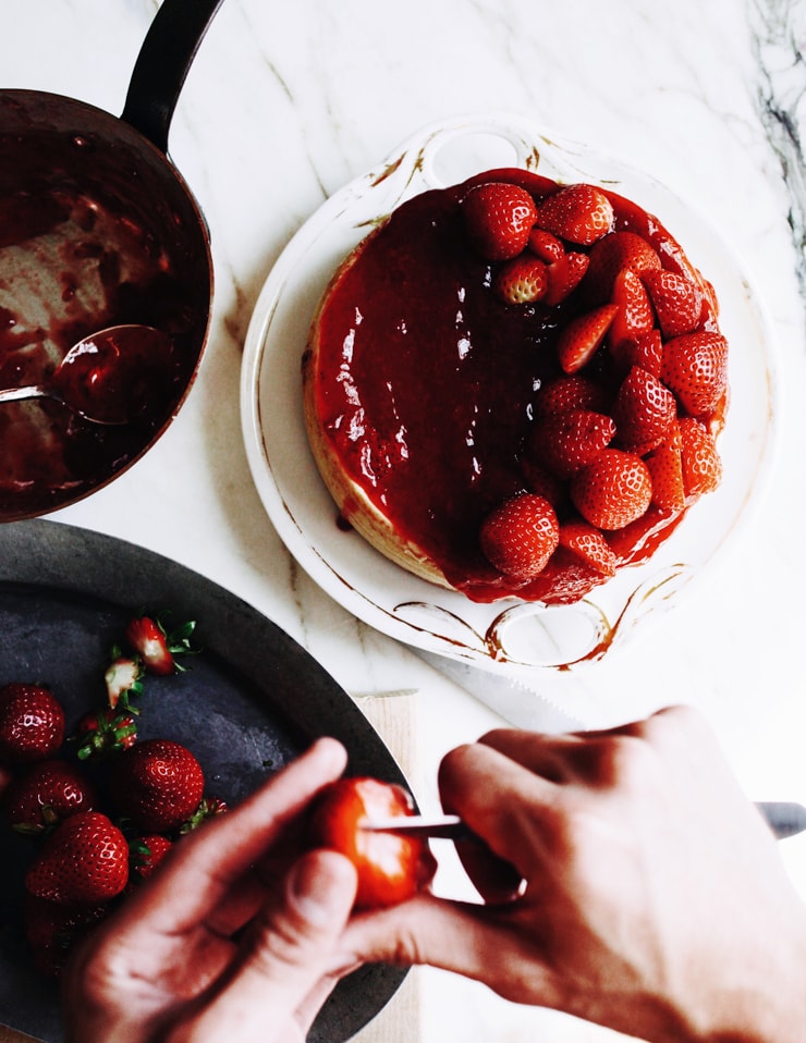 Assembling New York Cheesecake with Strawberries