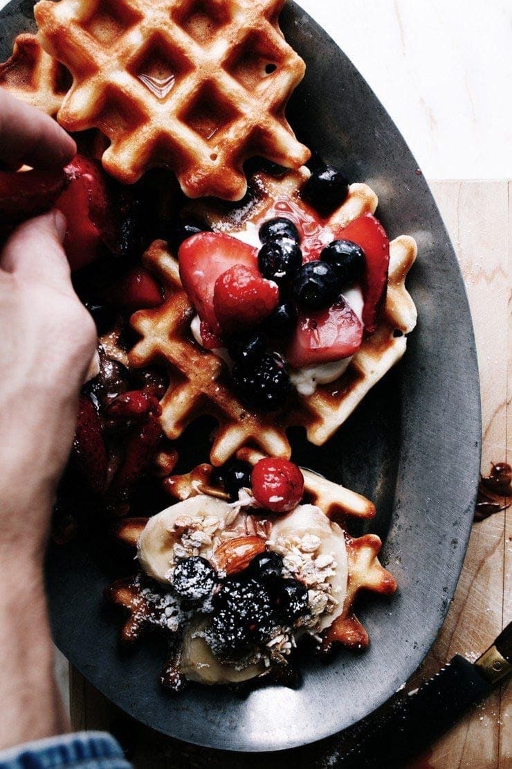 Homemade Easy Belgian waffles recipe with berries, granola, and yogurt from sophisticatedgourmet.com