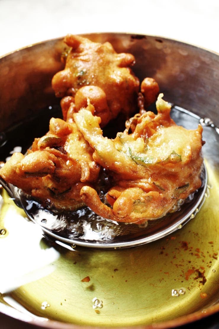 Frying pakoras from sophisticatedgourmet.com