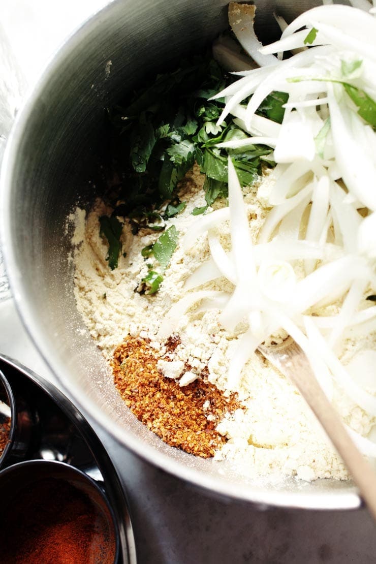 Onions, gram flour, spices, cilantro (coriander) for pakora recipe from sophisticatedgourmet.com