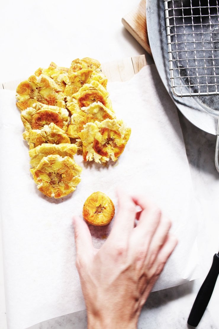 Smashing Plantains For Tostones