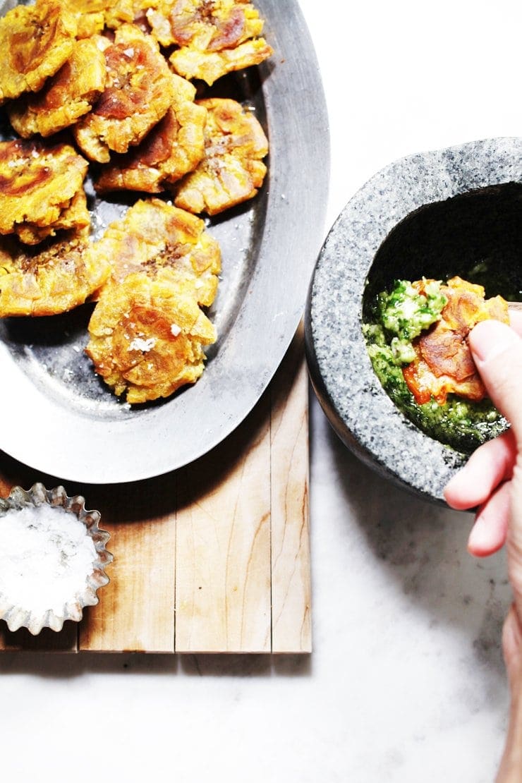 Dipping Dominican Tostones in Cilantro Ajillo